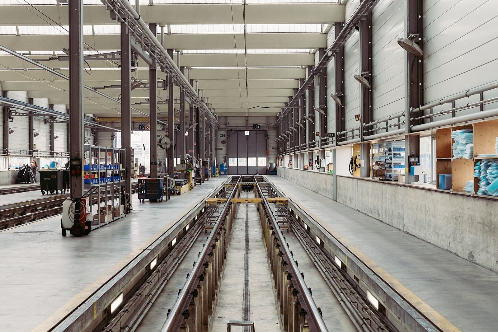 A long, empty factory assembly hall